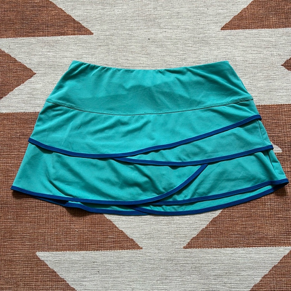 Medium Lucky in Love turquoise tiered tennis skirt.